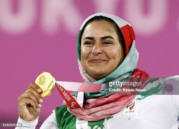 Zahra Nemati of Iran poses with the gold medal for the women's archery individual recurve at the Tokyo Paralympics on Sept. 2 at Yumenoshima Park...