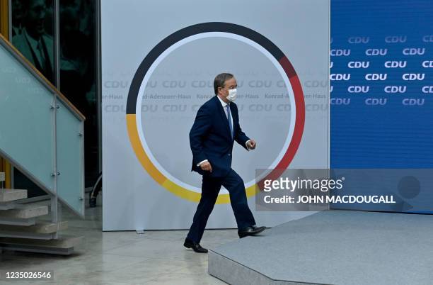 North Rhine-Westphalia's State Premier and Germany's conservative Christian Democratic Union's chancellor candidate Armin Laschet steps on the podium...