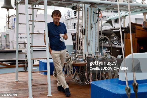 Honorary President of the Nicolas Hulot Foundation, and France's former Environment Minister Nicolas Hulot poses on the sailboat "7th continent" to...