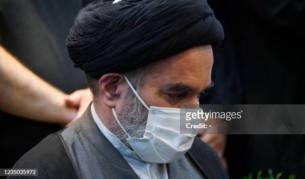 Mohammed Rida, son of Iraq's top Shiite cleric Grand Ayatollah Ali Sistani, mourns the death of Ayatollah Mohammad Said al-Hakim, one of Iraq's top...