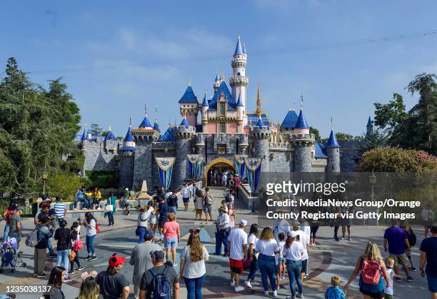 Visitors to Disneyland in front of Sleeping Beauty Castle inside Disneyland in Anaheim, CA, on Friday, September 3, 2021.