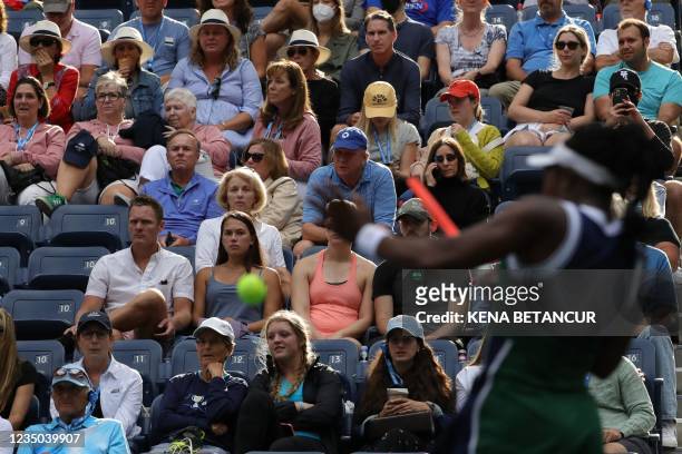 Spectators watch as USA's Sloane Stephens hits a return to Germany's Angelique Kerber during their 2021 US Open Tennis tournament women's singles...