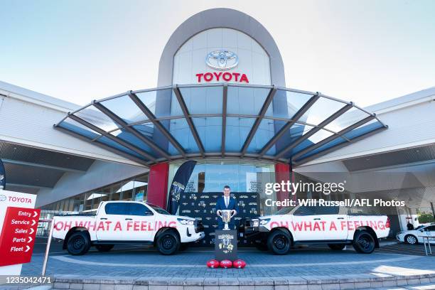 Premiership Cup Ambassador Glen Jakovich poses with the Premiership Cup during the Premiership Cup Tour Launch at the Grand Toyota Dealership on...