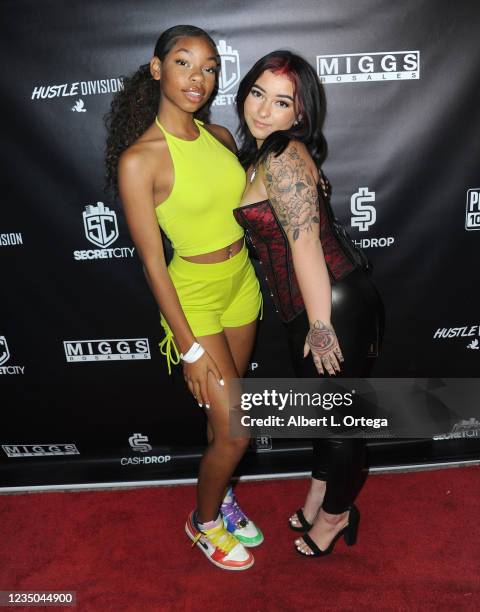 Dai Time and Danielle Cohn attend Secret City Glow In the Dark Event held at Black Star Burger LA on September 4, 2021 in Los Angeles, California.