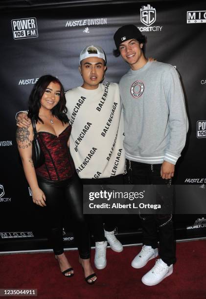 Danielle Cohn, Miggs Rosales and Mason Patterson attend Secret City Glow In the Dark Event held at Black Star Burger LA on September 4, 2021 in Los...