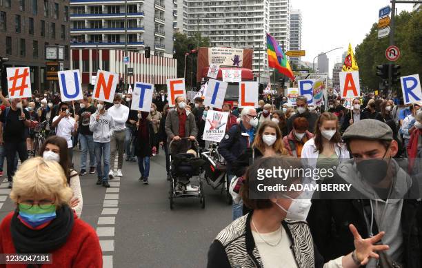 Participants attend a demonstration organised by the "#unteilbar" movement with the motto "For a just society based on solidarity" on September 4,...