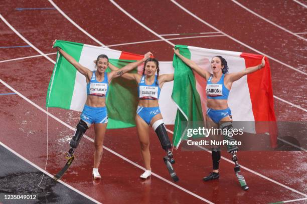 Tokyo, Japan. Silver medalist Martina Caironi of Team Italy, right, gold medalist Ambra Sabatini of Team Italy, second right, and bronze medalist...