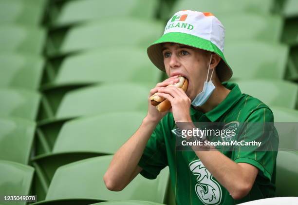 Dublin , Ireland - 4 September 2021; A Republic of Ireland supporter enjoys a hotdog before the FIFA World Cup 2022 qualifying group A match between...