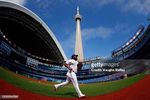 Vladimir Guerrero Jr. #27 of the Toronto Blue Jays runs to the dugout prior to a MLB game against the Oakland Athletics at Rogers Centre on September...
