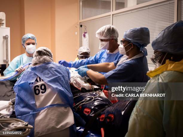 Covid 19 patient is prepared at the intensive care unit before being transferred as part of the Hippocampe operation on September 3, 2021 at the...