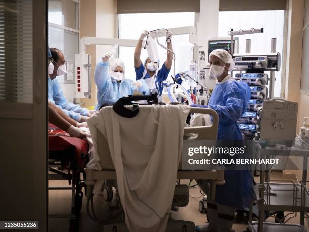 Covid 19 patient is prepared at the intensive care unit before being transferred as part of the Hippocampe operation on September 3, 2021 at the...