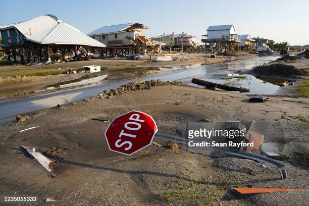 Bent stop sign in a storm damaged neighborhood after Hurricane Ida on September 4, 2021 in Grand Isle, Louisiana. Ida made landfall as a Category 4...