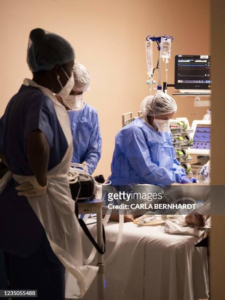 Covid 19 patient is prepared at the intensive care unit before being transferred as part of the Hippocampe operation on September 3, 2021 at the...
