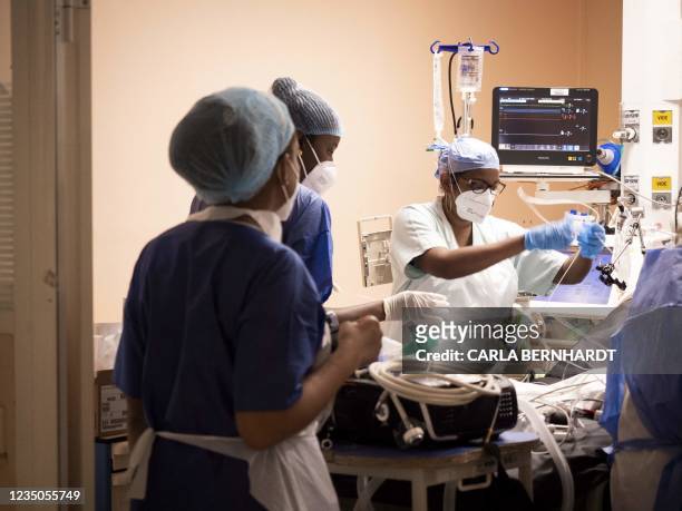Covid 19 patient is prepared at the intensive care unit before being transferred as part of the Hippocampe operation on September 3, 2021 at the...