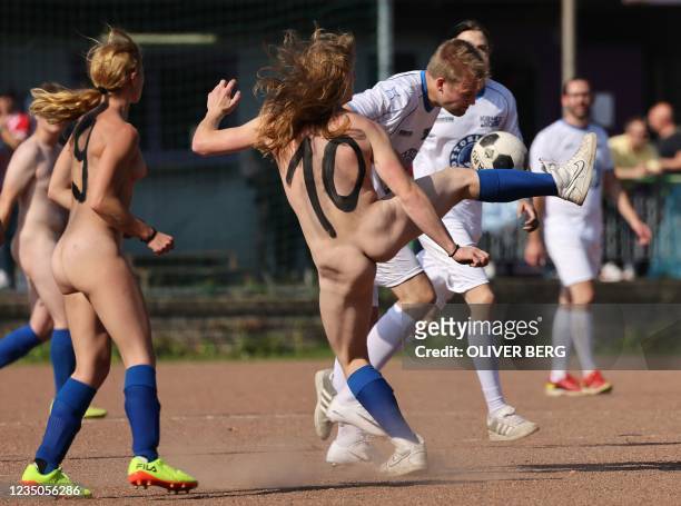 Players of the naked-national football team vie for the ball against the Pottoriginal team in Duisburg, Germany, on September 4, 2021. - With the...