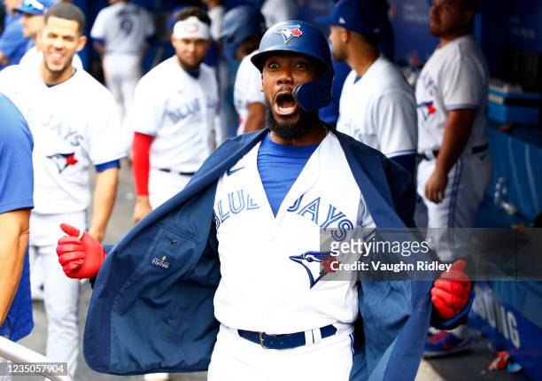 Teoscar Hernandez of the Toronto Blue Jays celebrates with the Blue Jays home run jacket after hitting a three-run home run in the seventh inning...