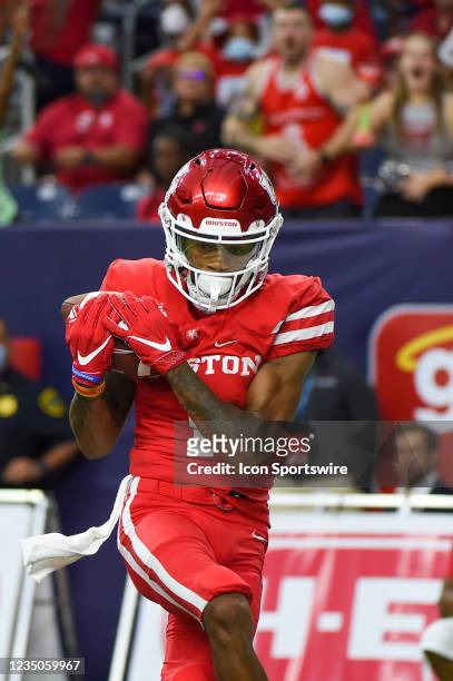 Houston Cougars wide receiver Nathaniel Dell hauls in a long first half touchdown reception during the football game between the Texas Tech Red...
