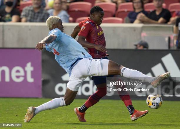 Nkosi Tafari of FC Dallas takes a stab at stopping Anderson Julio of Real Salt Lake during their game September 4, 2021 at Rio Tinto Stadium in...