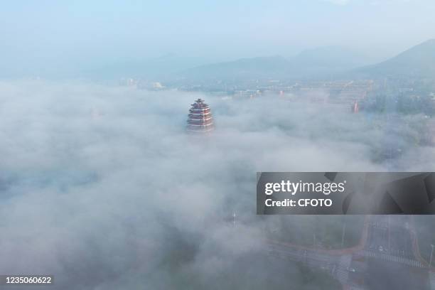 Yiyun Pavilion is seen under advection fog in Zaozhuang city, Shandong Province, China, September 3, 2021.