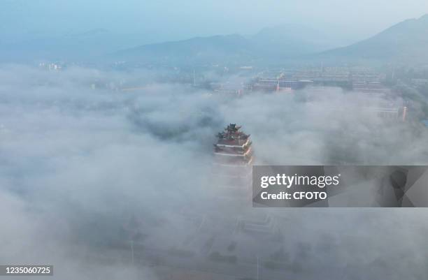 Yiyun Pavilion is seen under advection fog in Zaozhuang city, Shandong Province, China, September 3, 2021.