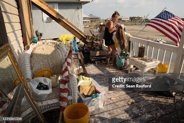 Kimberly Szeplaki cleans up her vacation house in the wake of Hurricane Ida on September 4, 2021 in Grand Isle, Louisiana. Ida made landfall as a...