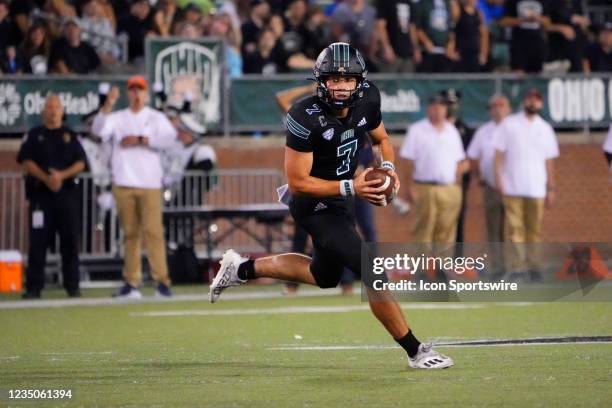 Ohio Bobcats Quarterback Kurtis Rourke rolls out looking to throw the ball during the first half of a college football game between the Syracuse...