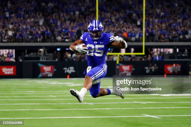 Running back Tyler Allgeier scores a touchdown during the Good Sam Vegas Kickoff Classic featuring the Brigham Young University Cougars and the...