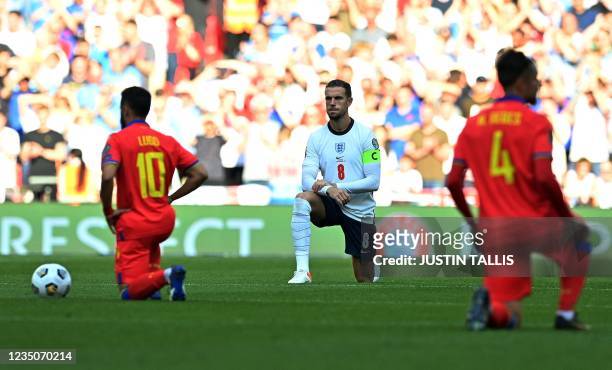 England's midfielder Jordan Henderson kneels in support of the Black Lives matter movement ahead of the FIFA World Cup 2022 qualifying match between...