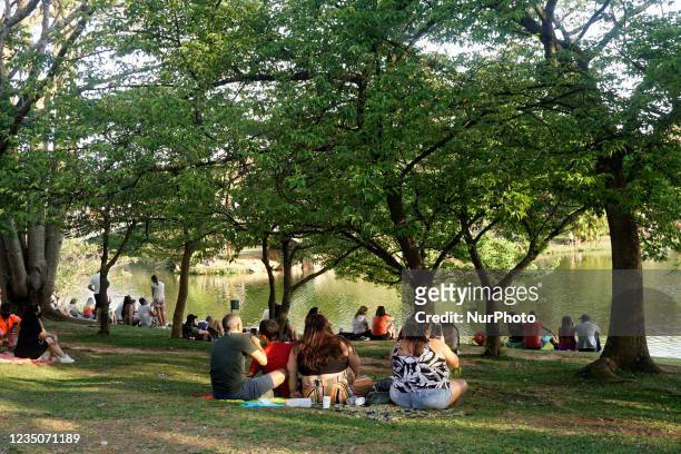 People enjoy a sun and heat Sunday at Ibirapuera Park in São Paulo.