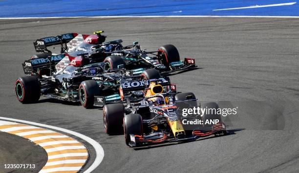 Max Verstappen followed by Lewis Hamilton and Valtteri Bottas after the start of the Dutch Grand Prix at the Zandvoort circuit. KOEN VAN WEEL