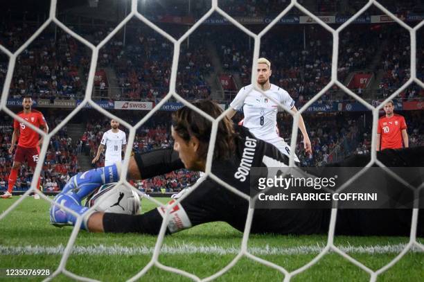 Switzerland's goalkeeper Yann Sommer saves a penalty kicked by Italy's midfielder Jorginho during the World Cup 2022 qualifier football match between...