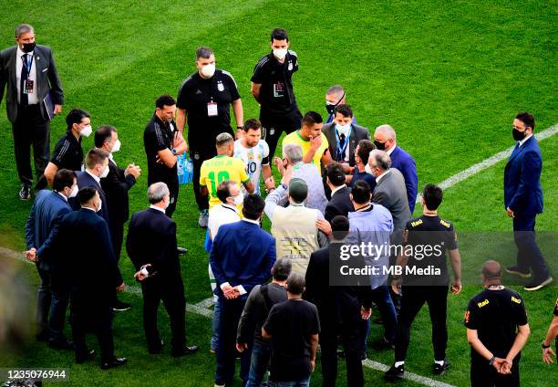 Health Staff of ANVISA of Brazil argue with Lionel Messi of Argentina and Neymar of Brazil on the field during a match between Brazil and Argentina...