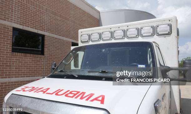 An ambulance is parked outside the Bellville Medical Center after dropping off a patient, in Bellville, Texas, September 1, 2021. - Hospitals in...