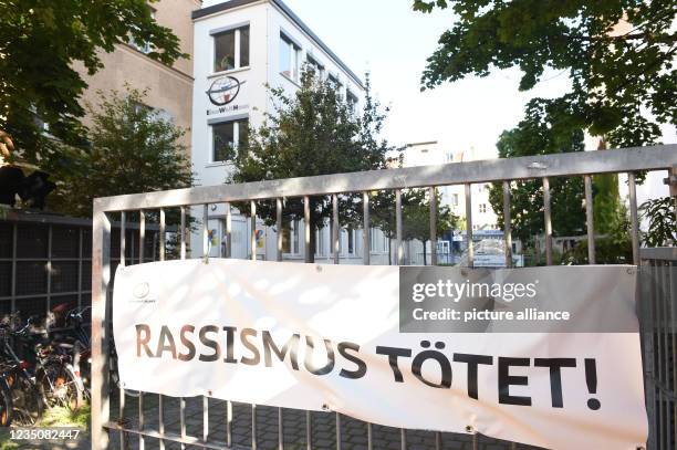 September 2021, Bavaria, Munich: At the entrance to the One World House, a banner with the words "Racism kills" hangs at the press day before the...