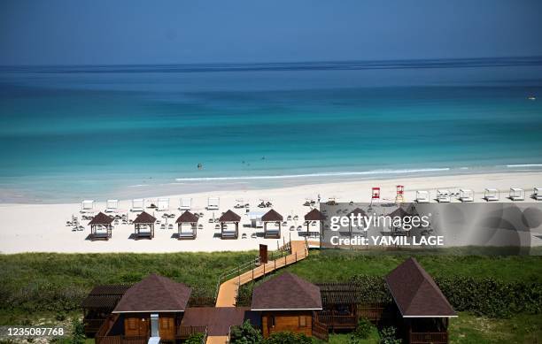 General view of tourists on the beach at the Melia Internacional Varadero Hotel in Varadero, Cuba, on September 3, 2021. - Cuba will gradually reopen...