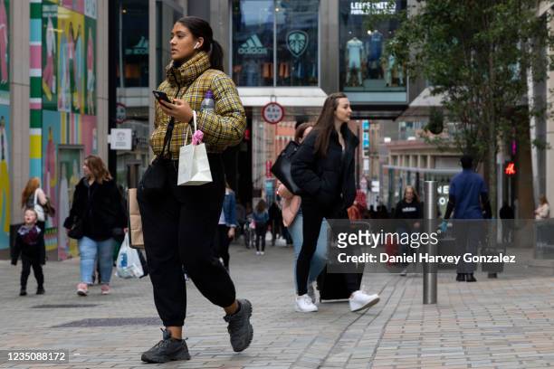 People, some with shopping bags, out and about in the city centre on 4th September, 2021 in Leeds, United Kingdom. Despite a rise in footfall across...