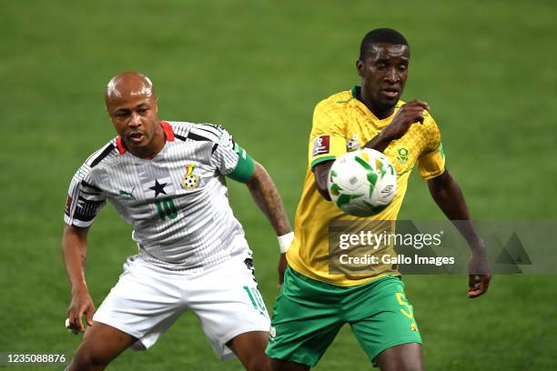 Andre Ayew of Ghana and Siyanda Xulu of South Africa during the 2022 FIFA World Cup Qualifier match between South Africa and Ghana at FNB Stadium on...