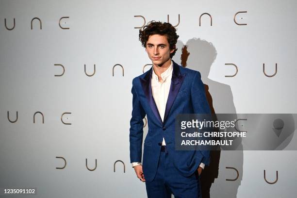 French-American actor Timothee Chalamet poses during a photocall ahead of the avant-premiere of the science-fiction movie "Dune" at the Grand Rex...