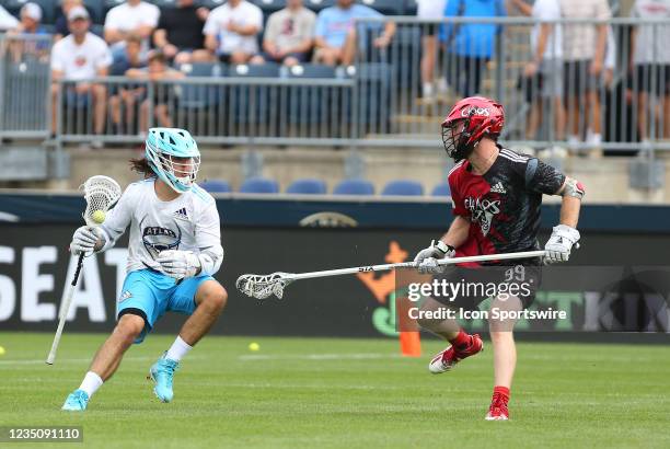 Atlas LC attack Jeff Heat defended by Chaos LC defense Jack Rowlett during the Premier Lacrosse League semi-final game between Atlas and Chaos on...