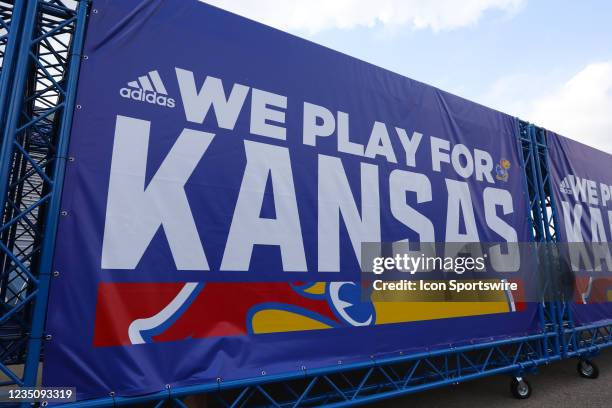 Sign says "We Play for Kansas" before a college football game between the South Dakota Coyotes and Kansas Jayhawks on Sep 3, 2021 at Memorial Stadium...