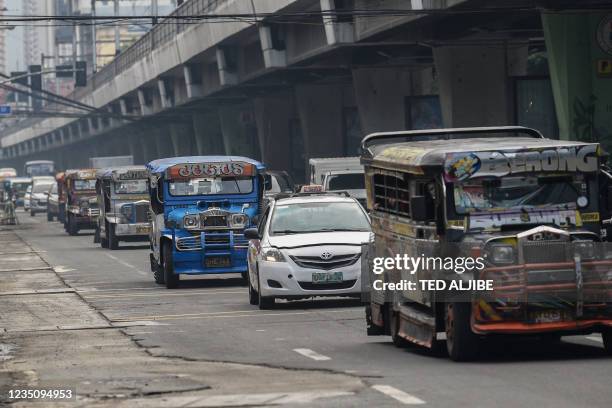 Passenger jeepneys commute along a road in Manila on September 7 a day before the authorities lift a stay-at-home order amid record Covid-19...