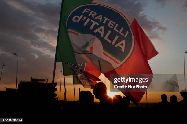 Fratelli dItalia flags on the sunset in Latina, Italy, on September 6, 2021. Fratelli d'Italia Leader Giorgia Meloni supports the election campaign...