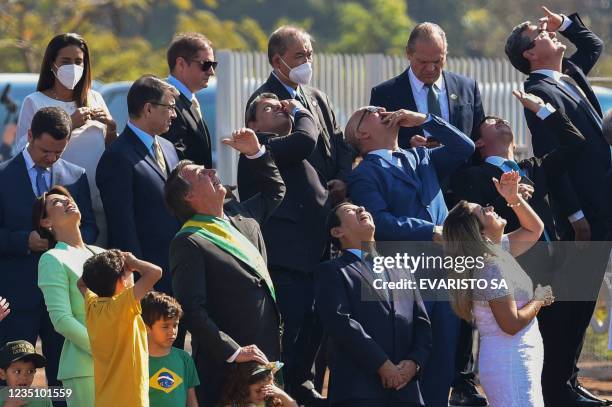 Brazilian President Jair Bolsonaro , Vice-President Hamilton Mourao , their respective wives Michelle and Paula, and ministers take part in the...