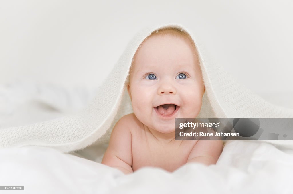 Smiling Danish baby girl with blue eyes