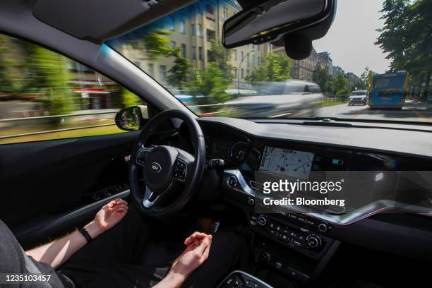 Safety driver behind the wheel of a Vay teledriven electric vehicle in Berlin, Germany, on Tuesday, Aug. 24, 2021. Vay, which has been quietly...