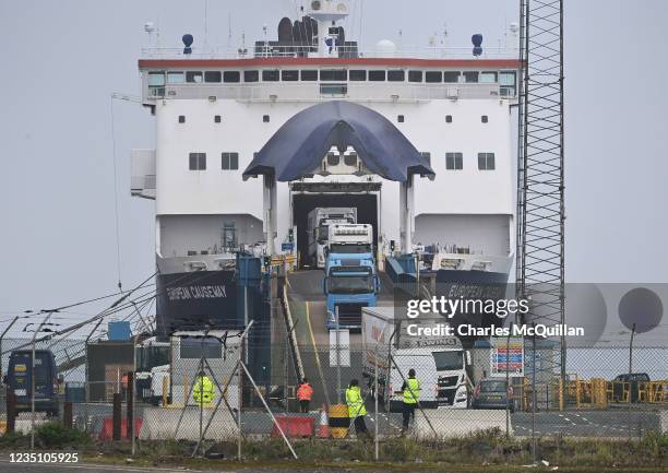 Customs and border officials watch on as freight disembarks at Larne harbour which is one of the main entry points between Northern Ireland and the...