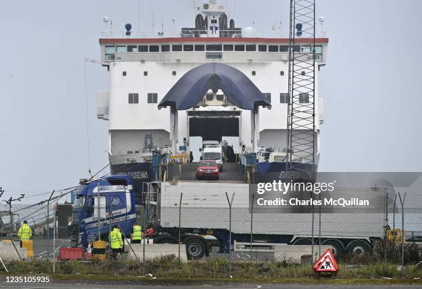 Customs and border officials watch on as freight disembarks at Larne harbour which is one of the main entry points between Northern Ireland and the...