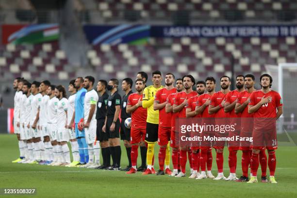 Iran's players sing their national anthem during he 2022 FIFA World Cup Qualifier match between Iraq and Iran at Khalifa International Stadium on...