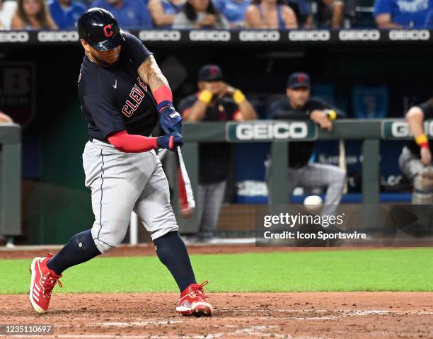 Cleveland Indians left fielder Harold Ramirez connects on a pitch during a Major League Baseball game between the Cleveland Indians and the Kansas...