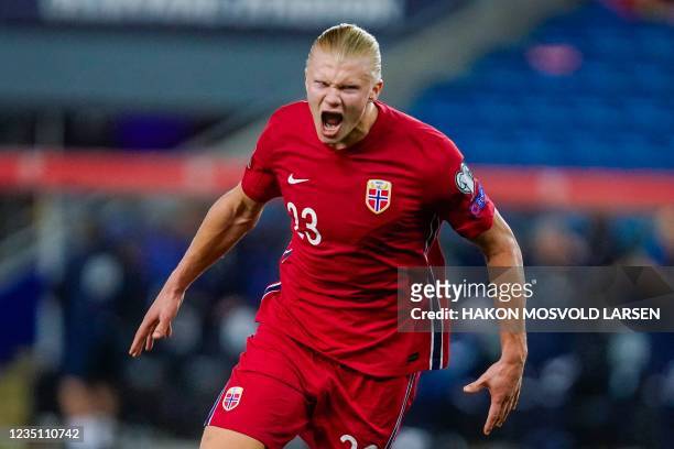 Norway's forward Erling Braut Haaland celebrates scoring the 5-1 goal during the FIFA World Cup Qatar 2022 qualification Group G football match...